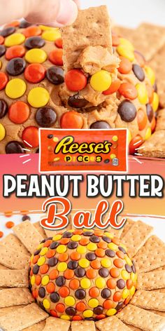 a peanut butter ball with candy corn and reese's cookies on top is being held up by a hand