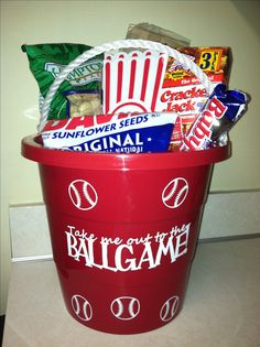 a red bucket filled with snacks and candy