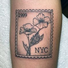 a stamp with two flowers on it and the word new york written in black ink