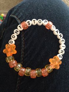 "DONT STOP DANCING" yellow/orange kandi single (copied from Pinterest) Yellow Kandi Bracelets, Rave Kandi Bracelets, Rave Kandi Ideas, Rave Candy, Kandi Singles, Rave Bracelets, Rave Kandi, Kandi Inspo, Diy Kandi Bracelets