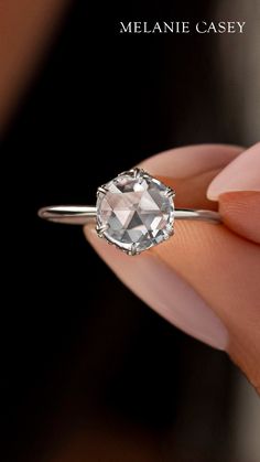 Our Rose Basket Ring has the vintage appeal of a rose cut diamond focal, set on a dainty 14k gold band with a hidden halo of diamonds around the setting. This unique engagement ring can be made in yellow, rose, white gold or platinum - see more at melaniecasey.com!