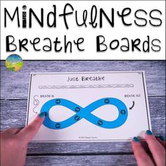 a hand holding a blue paper with the words mindfulness breathe boards on it