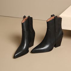 Step into winter sophistication with these smooth cow leather boots. The Pointed toe and 8cm heel are perfect pairings for any chic ensemble. Don't settle for less—experience luxury today. Fall High Heeled Boots With Branded Heel Counter, Classic Chelsea Boots With Sculpted Heel For Fall, High Heel Boots With Branded Heel Counter For Fall, Chic High Ankle Boots With Contrasting Heel, Classic Stacked Heel Boots For Fall, Classic Mid-calf Boots With Sculpted Heel For Fall, Chic Chelsea Boots With Reinforced Heel For Winter, Chic Winter Chelsea Boots With Reinforced Heel, Fall High Ankle Heeled Boots With Contrasting Heel