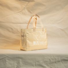 A High Quality, Lightweight Yet Durable Tote Bag by WOLFpak. This Tote Bag Is Extremely Practical For The Office, Gym, Beach and More! 20L Tote Bag 17in (43cm) W x 13in (33cm) H x 6in (14cm) Waterproof Surface Oxford 1000D Polyester Dual Exterior Side Pockets Hand Carrying Straps or Over the Shoulder Branded Embroidery Logo Molle Webbing Easy Clean Polyurethane Lining Protective Inside Computer Sleeve 17in x 10in (Fits 16” Mac Pro) Inside Zipper Pocket (2) Mesh Card Pockets Inside Computer, Molle Webbing, Office Gym, Mini Mochila, Computer Sleeve, Mac Pro, Backpack Brands, Dog Supplies, Embroidery Logo