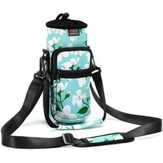 a blue and white flowered bag with black straps on it's shoulder strap