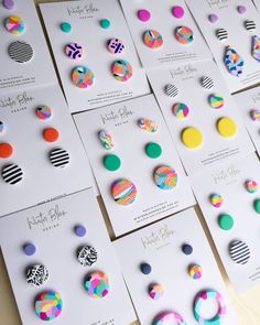 many different colored circles and dots on white cards