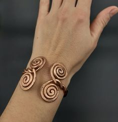 This is an adjustable, massive bracelet made of raw and pure copper.  Small, adjustable circumference: 16-20 cm Dacian inspiration. It can be made to order, any size. Wearing copper jewelry can leave greenish marks on the skin, that can be cleaned with soap and water. Wearing copper jewelry can stimulate healing, especially due to its ability to balance polarities or, in other words, the flow of projective and receptive energies. Nowadays, jewelry and ornaments made of pure copper are worn for h Adjustable Unique Rose Gold Bracelets, Unique Adjustable Rose Gold Bracelet, Adjustable Unique Rose Gold Bracelet, Adjustable Spiral Copper Bracelets, Adjustable Spiral Copper Bracelet, Adjustable Copper Spiral Bracelet, Adjustable Copper Bracelet, Unique Copper Adjustable Bracelets, Adjustable Copper Spiritual Bracelets