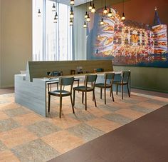 an empty conference room with chairs and tables in front of a large painting on the wall