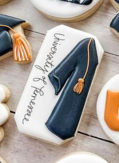 decorated cookies with graduation caps and gowns on them