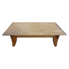 a wooden coffee table with two legs and a square shape on the top, against a white background