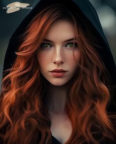 a woman with long red hair wearing a hoodie and green eyes is looking at the camera