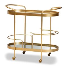 a gold bar cart with glass shelves and wheels