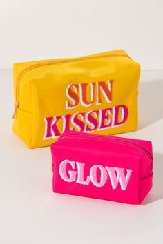 Carry all your odds and ends in style with Shiraleah's "Glow" Zip Pouch. Made of durable polyester in a vibrant pink, this rectangular case can fit inside of a larger zip pouch while still providing plenty of room inside. The trendy toothbrush embroidery spells the word "Glow" in light pink and white lettering. Pair with other items from Shiraleah to complete your look! Features a top zip closure and embroidered lettering Shiraleah is a trend-driven lifestyle brand focused on the little gifts th Trendy Pink Rectangular Pouch, Trendy Pink Rectangular Cosmetic Bag, Pink Rectangular Cosmetic Bag With Zipper, Pink Pouch, Odds And Ends, Zip Pouch, Large Bag, Sun Kissed, Bright Orange