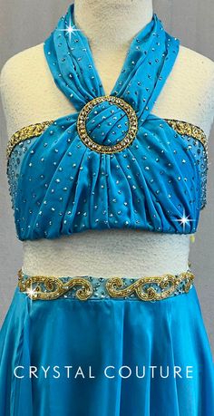 Gorgeous Aqua Blue two piece bra-top and skirt/trunk made from chiffon and lycra. The halter top is decorated with a Gold corded trim, large Gold buckle and Swarovki rhinestones. Matching chiffon four panel full circle skirt has Gold beaded appliques and Swarovski rhinestones on the waistband. Costume has a built-in matching lycra trunk. Very pretty costume! Bottoms and bra are a beautiful watercolor blue. *Accessories include: Gold trim headband Over 5 gross of Swarovski XIRIUS Aquamarine AB 20 Festive Embellished Royal Blue Sets, Blue Mermaid Bra Top, Turquoise Dance Costume, Blue Acrobat Costume, Blue Crystal Rhinestone Costume Necklace, Baggy Clothing, Pretty Costume, Blue Two Piece, Full Circle Skirt