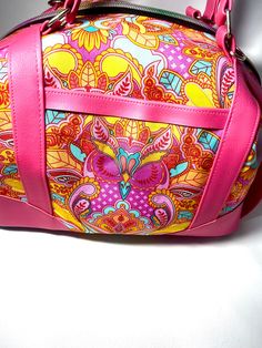 "Sierra zip top handbag is large and roomy! Approximately 13\" wide 10\" tall and 6\" deep. Because each bag is made by hand, approximate dimensions may vary slightly. Exterior features Tula Pink, Owl Print and magenta faux leather accents. Front features a slip pocket for quick access. Rainbow nylon zipper closure on top. Base features turquoise colored faux leather and purse feet. Interior is fully lined with turquoise cotton and features a zippered pocket and slip pocket. Pattern by Swoon patterns \"Sierra zip top handbag\" Handmade by me." Pink Satchel Shoulder Bag With Luggage Sleeve, Pink Tote Bag For Trips, Pink Satchel Weekender Bag, Pink Tote Duffle Bag With Removable Pouch, Pink Duffle Bag With Removable Pouch For Everyday Use, Pink Satchel Duffle Bag For Everyday Use, Pink Bag With Zipper Closure For Trip, Pink Shoulder Weekender Bag, Pink Tote Satchel With Zipper Pocket