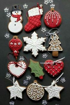 christmas cookies and decorations are arranged on a table