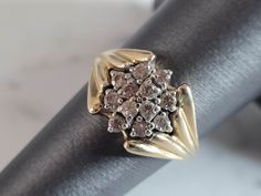 A WOMENS VINTAGE ESTATE 14K GOLD DIAMOND CLUSTER RING.  THE RING IS A SIZE 6.25 AND WEIGHS 4.3g.  THERE ARE ABOUT .26cts OF DIAMONDS IN THIS RING.  THE RING MAKES A BEAUTIFUL, IMPRESSIVE GIFT FOR THAT SOMEONE SPECIAL.  ANY OTHER QUESTIONS, PLEASE ASK.  BE SURE TO CHECK OUT SOME OF MY OTHER GREAT ITEMS UP FOR SALE. THANK YOU. Gold Heart Bracelet, Silver Horse, Diamond Cluster Ring, Diamond Cluster, Heart Bracelet, Cluster Ring, Womens Jewelry Rings, Gold Diamond, Jewelry Rings