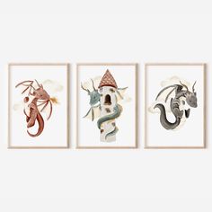 three framed art prints with different types of animals and houses on the wall above them