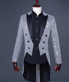 a mannequin dressed in a silver sequin jacket and black dress shirt,