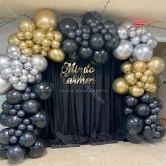 an arch made out of balloons with the words mirada written in gold and silver