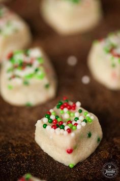 some cookies with sprinkles and candy on them