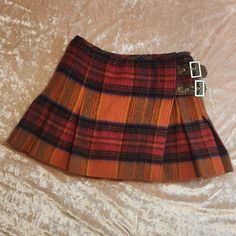 Vivienne Westwood Wool Tartan Pleaded Skirt Punk Dollette Coquette Nymphet From London Brand Vivienne Westwood Iconic Wool Tartian Plaid Pleaded Skirt Side Buckles To Take It In With Snake Skin Print Thick Wool Blend Material Beautiful Orange Color Woth Brown Tones Perfect For The Current Trending Y2k Size/Quality Small Label Size 2 Wool Allergy Warning Has Zero Stretch Adjustable Side Buckle For Going In Smaller No Rips Holes Marks Scuffs In New Condition Length 37cm Waist 32~34cm (Max) Discount Code New To Posh? Use Code Claudias_shop To Receive $10 Off Your Order ! #Viviennewestwood #Dollette #Y2k #Coquette #Skirt 1273 Fitted Vintage Brown Mini Skirt, Vintage Pleated Mini Skirt For Fall, Vintage Brown Lined Mini Skirt, Vivienne Westwood Iconic, Vivienne Westwood Clothes, Tartan Skirt Outfit, Wool Skirt Outfit, Vivienne Westwood Punk, Coquette Skirt