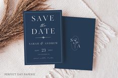 the save the date card is next to some dried grass