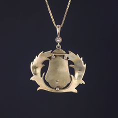 This 14k gold pendant features a pharaoh adorned with glittery diamond accents. The pendant was originally an antique brooch (circa 1910) that our jeweler transformed by removing the pin findings and adding a diamond surmount and 14k gold bail. The pendant measures 1.5 inches from the top of the bail to bottom by 1.25 inches wide, and it is in great condition. We are providing the option to purchase the pendant with or without the 18 inch, 14k gold chain depicted in the photo. Note: The antique Antique Diamond Accent Pendant Necklace, Antique Pendant Necklace With Diamond Accents, Antique Diamond Pendant Jewelry, Antique Pendant Jewelry With Diamond Accents, Art Deco Single Cut Diamond Pendant Jewelry, Art Deco Pendant Jewelry With Single Cut Diamonds, Art Deco Single Cut Diamond Pendant, Art Deco Style Single Cut Diamond Pendant, Antique Necklace With Diamond Accents