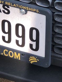 a close up of a license plate on a car