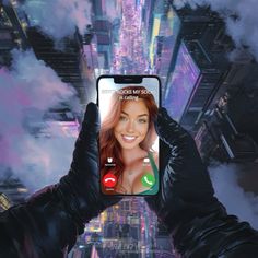 a person holding up a cell phone in front of a cityscape with skyscrapers