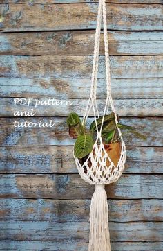 a macrame hanging planter with plants in it and the words pddt pattern and tutorial written below