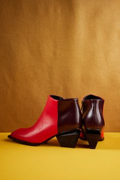 Take your style to new heights with the Jady X Geometry-heel Leather Ankle Boot. Featuring an angular toe and sharp diagonal lines, this boot is a geometric statement piece that will elevate any outfit. The unique and statement-making heel adds a touch of edginess and will make you stand out in a crowd. Trust us, your shoe collection needs this! 2.36'' heel 3.21" Shaft 9.8'' circumference Zip closure Genuine leather upper Leather lining Leather insole Rubber sole Note: Custom made-to-order, extr Modern Red Heels With Stacked Heel, Trendy Red Heeled Boots With Reinforced Heel, Red Stacked Heel Ankle-high Heels, Red Ankle-high Heels With Stacked Heel, Trendy Pointed Toe Boots With Red Sole, Trendy Boots With Red Sole And Pointed Toe, Red Heels With Contrasting Heel Counter, Red Heels With Contrasting Heel Counter And Low Heel, Red Pointed Toe Heeled Boots