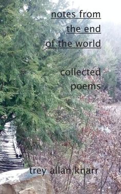 there is a poem written on the side of a stone wall with trees in the background