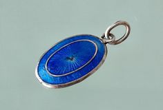 A lovely miniature oval silver and royal blue vitreous enamel Edwardian pendant , marked SILVER at the back in very good state  as pictured. Size: about 20 mm x 11 mm , please see photo with ruler Thank you for visiting Blue Oval Enamel Necklace, Blue Enamel Oval Pendant Jewelry, Blue Oval Pendant Collectible Jewelry, Antique Blue Oval Pendant Necklace, Blue Engraved Oval Pendant Jewelry, Blue Oval Pendant Jewelry, Engraved, Antique Blue Oval Pendant Jewelry, Vintage Blue Oval Pendant Jewelry, Edwardian Pendant