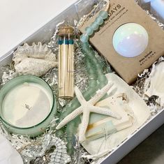 an open box filled with seashells and other items