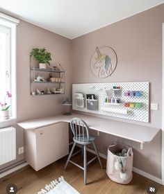 a room with a chair, desk and shelves on the wall in it's corner