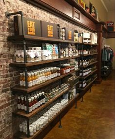 the inside of a store with shelves full of condiments