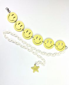 Smileys are made a soft pastel yellow which makes it the perfect accessory for colorful patterns. - Handmade with high quality materials that will last you many festival seasons- Chain is adjustable- The chain is lightweight acrylic- "Cosmic Drip" charm at end of chain White Chain Necklace For Festival, White Chain Necklace For Festivals, Trendy Adjustable Length Necklaces For Festivals, Casual Adjustable Yellow Necklace, Casual Yellow Necklace With Adjustable Fit, Cute Adjustable Yellow Necklaces, Cute Adjustable Yellow Necklace, Adjustable Yellow Jewelry With Chain, Trendy Adjustable Length Summer Necklaces