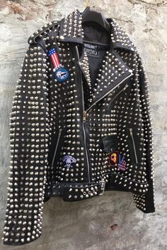 Material: Studded Jacket made with 100 % Genuine Top Quality Cowhide Leather Polyester Inner Lining & inside Pocket Long Spiked and Studded Used Each Single one is Punched with hands High Quality Spikes & Studs. Each securely added by hand Cropped, Vintage 0.9 to 1.0 MM Cowhide Leather used Zipper details on Sleeves Soft Black Real Leather Color: Black Studded Jacket, Black Leather Jacket, Workout Jacket, Zipper Detail, Winter Casual, Soft Black, Silver Studs, Punk Rock, Cowhide Leather