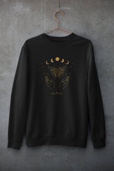 This boho butterfly sweatshirt with Cottagecore Aesthetic is soft, cozy, and stylish. Get this Dark Academia Sweatshirt now! Butterfly Sweatshirt Boho Sweater Oversized sweatshirt Crewneck sweater Indie Cothing For other cottagecore aesthetics, please click the link below: https://www.etsy.com/shop/TheNims?section_id=31793904 Browse through my other awesome items here: http://thenims.etsy.com/ ABOUT THE PRODUCT: Unisex Heavy Blend™ Crewneck Sweatshirt | GILDAN 18000 (Customer Favorite) A sturdy Cecropia Moth, Hidden Knowledge, Spirit Animal Totem, Moon Graphic Tee, Animal Totem, Curious Creatures, Inner Wisdom, Luna Moth, Mixed Feelings