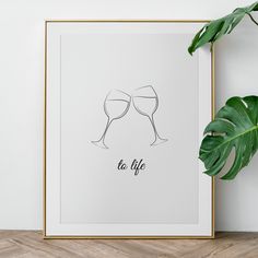 two glasses of wine with the words to life in black ink on a white background