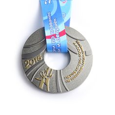 a silver medal with a blue ribbon around it's neck and two gold medals on each side