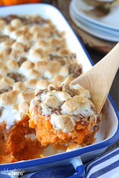 a casserole dish filled with sweet potato casserole and marshmallows