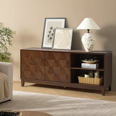 a living room scene with focus on the sideboard and lamp in the foreground