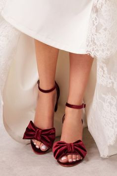 Introducing you to our brand new bridal bow sandals. They are handmade of velvet, fully lined with leather and set on a luxurious sole. Our ruby red wedding shoes combine comfort and elegance while they upgrade any bridal look. These velvet heeled sandals perfectly match with lace, satin or organza wedding gowns and they are so much wearable after your big day too! Hebe bridal bow sandals with ankle strap come in 5 colors and rest on a super stable and comfy block heel that comes in 2 heights. Ruby Red Wedding, Bridal Bow, Red Wedding Shoes, Velvet Heels, Bow Sandals