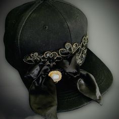 Black Baseball Cap/Hat ~ Decorative Elements Added / Satin Ribbon And Emblem / Pearl Button Fancy Embellished Hats / Hand Made By Liz / One Of A Kind Price: $25 Location: Punta Gorda Isles, Florida Size: One Size Fits Most Materials: New, Used, And Vintage Elements Artistically Combined Preowned Cotton Hat Ribbon Emblem Bow Pearl Button Lots Of Glue As An Interior Designer, I Have Accumulated Interesting "Spare Parts" Over The Years, So Decided To Utilize Them To Fabricate Hats, Jewelry, Decorat Embellished Hats, Vintage Elements, Black Baseball Cap, Cap Designs, Street Fashion Men Streetwear, Men Streetwear, Ball Caps, Cotton Hat, Decorative Elements