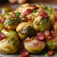 brussel sprouts with bacon and mustard sauce on a white platter