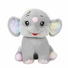 an elephant stuffed animal sitting up against a white background