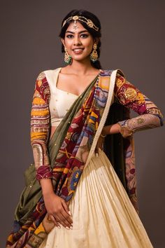 Cream base attached cancan lehenga with village kalamkari hand painted patterns and embroidery. Paired with padded cream blouse embroidered with glass beads and olive green printed dupatta with contrast border. - Aza Fashions Traditional Sharara With Kalamkari Print For Festive Occasions, Traditional Kalamkari Print Sharara For Festive Occasions, Traditional Kalamkari Sharara For Festive Occasions, Traditional Fitted Pre-draped Saree With Kalamkari Print, Festive Set With Kalamkari Print And Traditional Drape, Festive Sets With Kalamkari Print And Traditional Drape, Kalamkari Print Art Silk Pre-draped Saree For Wedding, Wedding Chanderi Pre-draped Saree With Kalamkari Print, Wedding Anarkali Set With Kalamkari Print In Art Silk