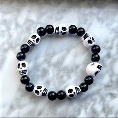 This Decorative Bracelet Is Perfect For Halloween! -Color - Black Beads & White & Black Skulls -Stretchy Elastic -Slips On Over Hand Offers Welcome! -Smoke Free Home! -Fast Shipping! -Top Rated Seller! Horror Bracelet, Skull Bracelet Pattern, Diy Kandi Bracelets, Diy Kandi, Holiday Bracelets, Halloween Color, Pearl Cuff Bracelet, Halloween Bracelet, Sister Bracelet